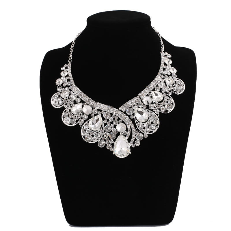 A sparkling silver statement necklace featuring intricate filigree work and cascading teardrop-shaped crystals from a korean super alloy jewelry set ideal for elegant occasions.