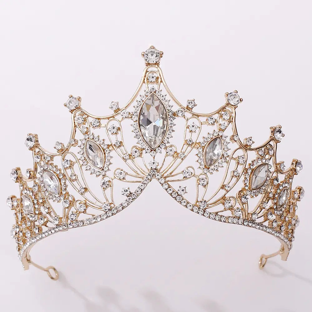 A gold-toned classic vintage bridal tiara adorned with sparkling clear crystals and larger marquise-cut stones for elegant bridal wear.