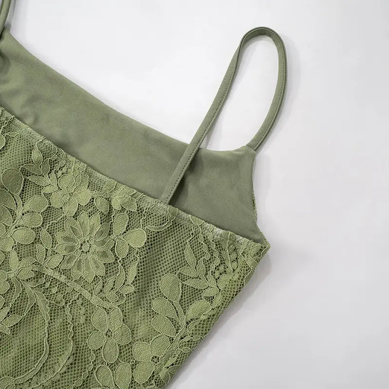 olive green lace camisole with delicate floral embroidery and thin straps showcased as part of a sage green lace backless tube sling stitching ruffle hip suit.