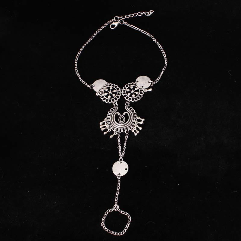 silver-toned bohemian jewelry antique foot chain featuring intricate filigree designs, circular medallions, and dangling charms in antique silver color.