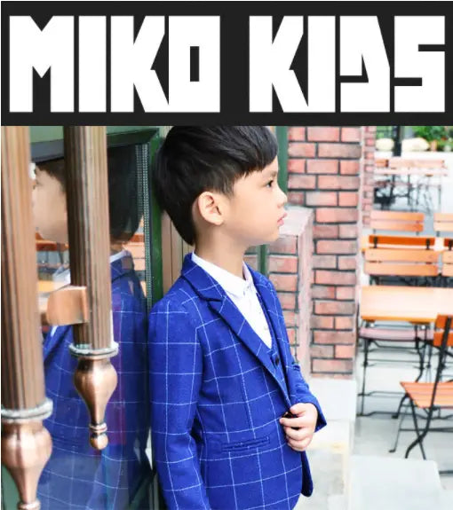 Blue plaid children’s three-piece fashion suit featuring a tailored comfort suit jacket with a classic check pattern and white shirt underneath.