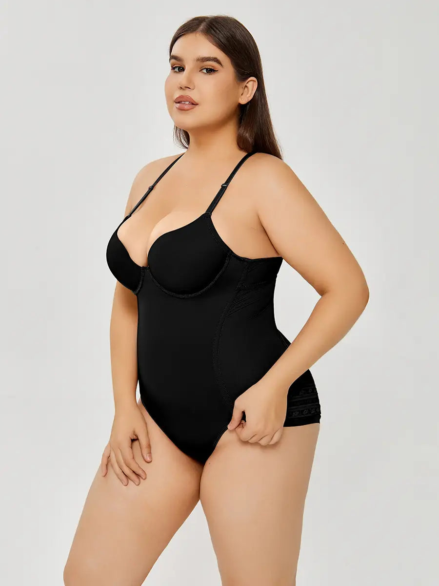 plus size ultra firm control black bodycon bodysuit with thin straps and lace trim at the hem designed as a firm control body shaper.