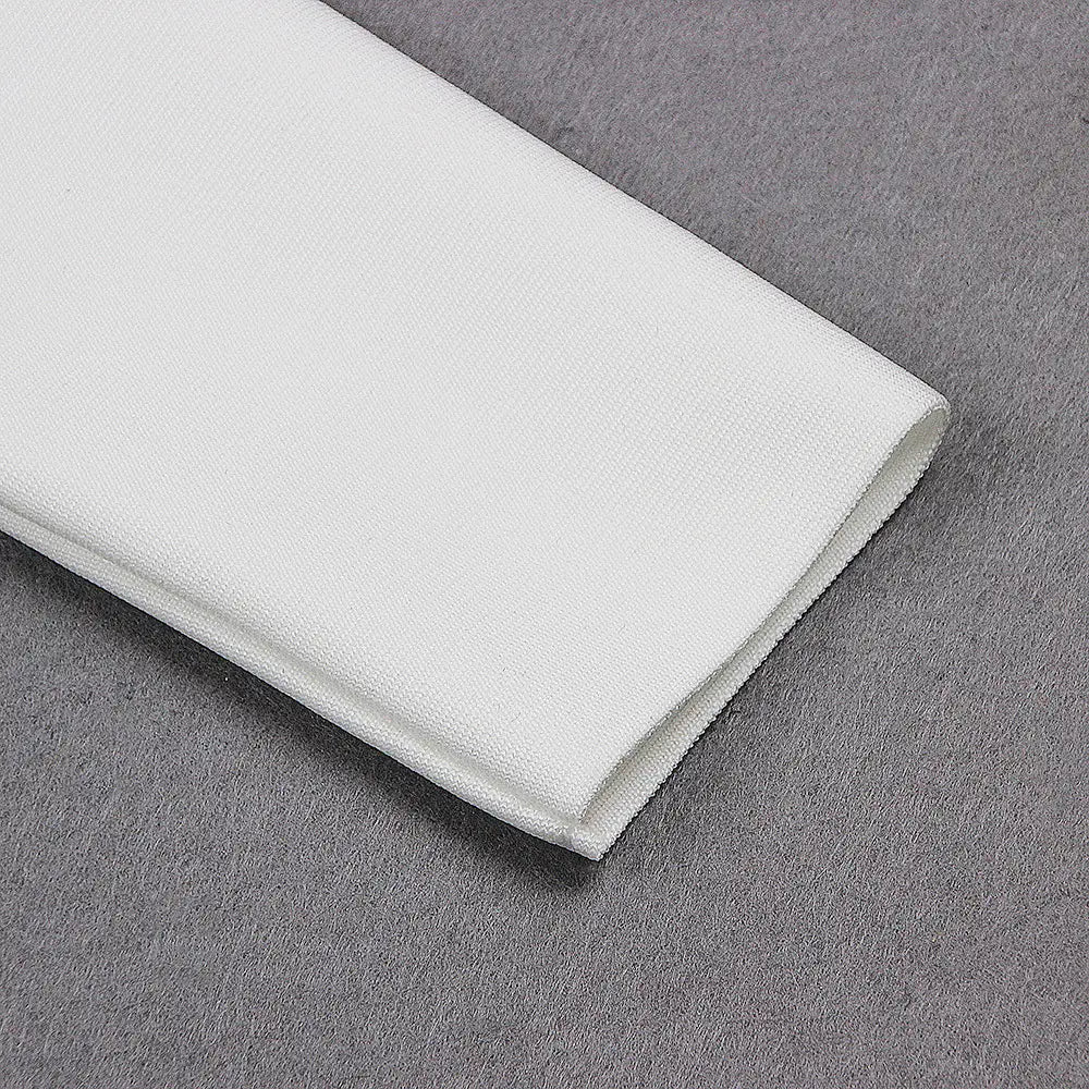 a crisp white microfiber cloth with a soft textured surface complements the white high neck chest scheming hip short skirt.