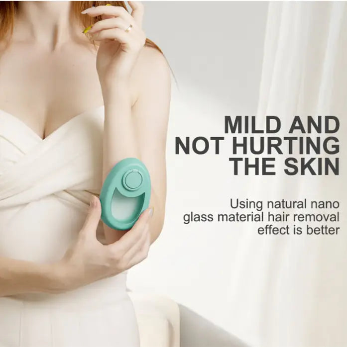 Teal oval-shaped handheld hair eraser device with a circular button on top designed for crystal hair removal.