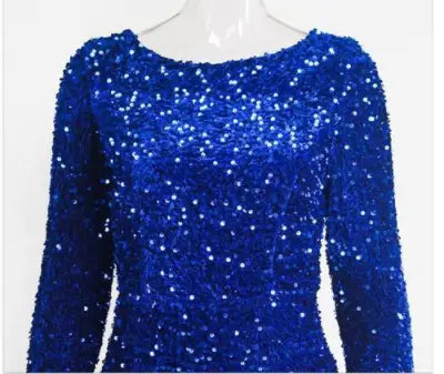 A dazzling royal blue long-sleeved evening gown for women featuring modest stretch sequin fabric with densely packed shimmering embellishments and a rounded neckline.