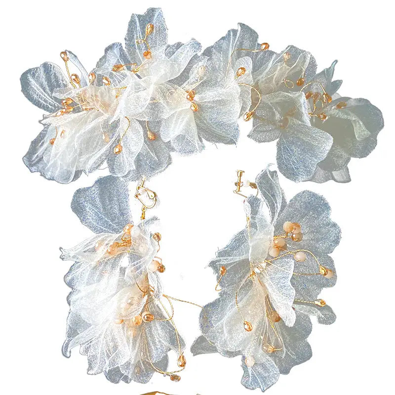 Delicate silver and white organza tulle flower headband earring set adorned with golden beads featuring a flower headband earring design.
