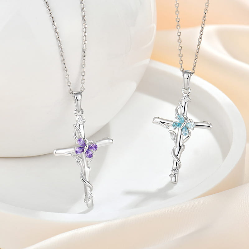 Two sterling silver cross necklaces for women each featuring a floral design with blue and purple gemstones in a blue gemstone cross necklace sterling collection.