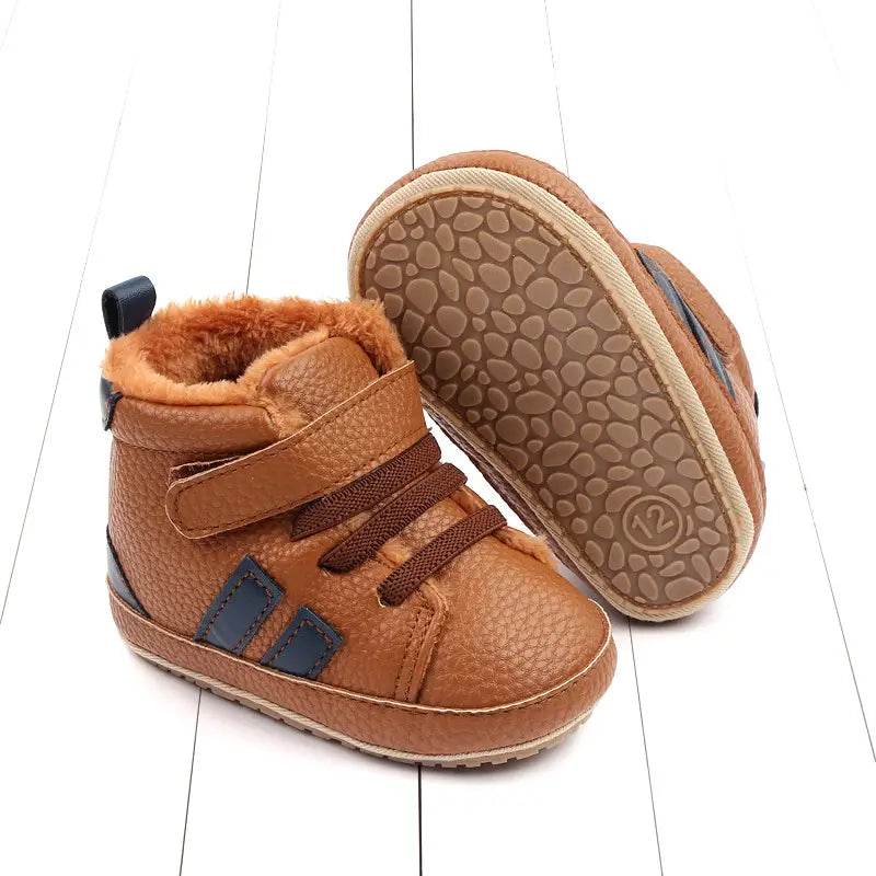 brown leather baby boot with fuzzy lining and dark blue stripes in plush lined sports soft-sole cotton baby shoes designed as comfortable cotton shoes for infants