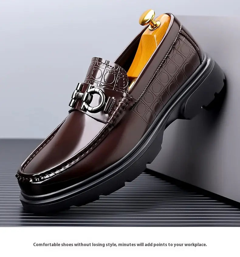 brown croc-embossed leather loafers with a metallic horsebit buckle and chunky black rubber sole designed as platform retro casual shoes.