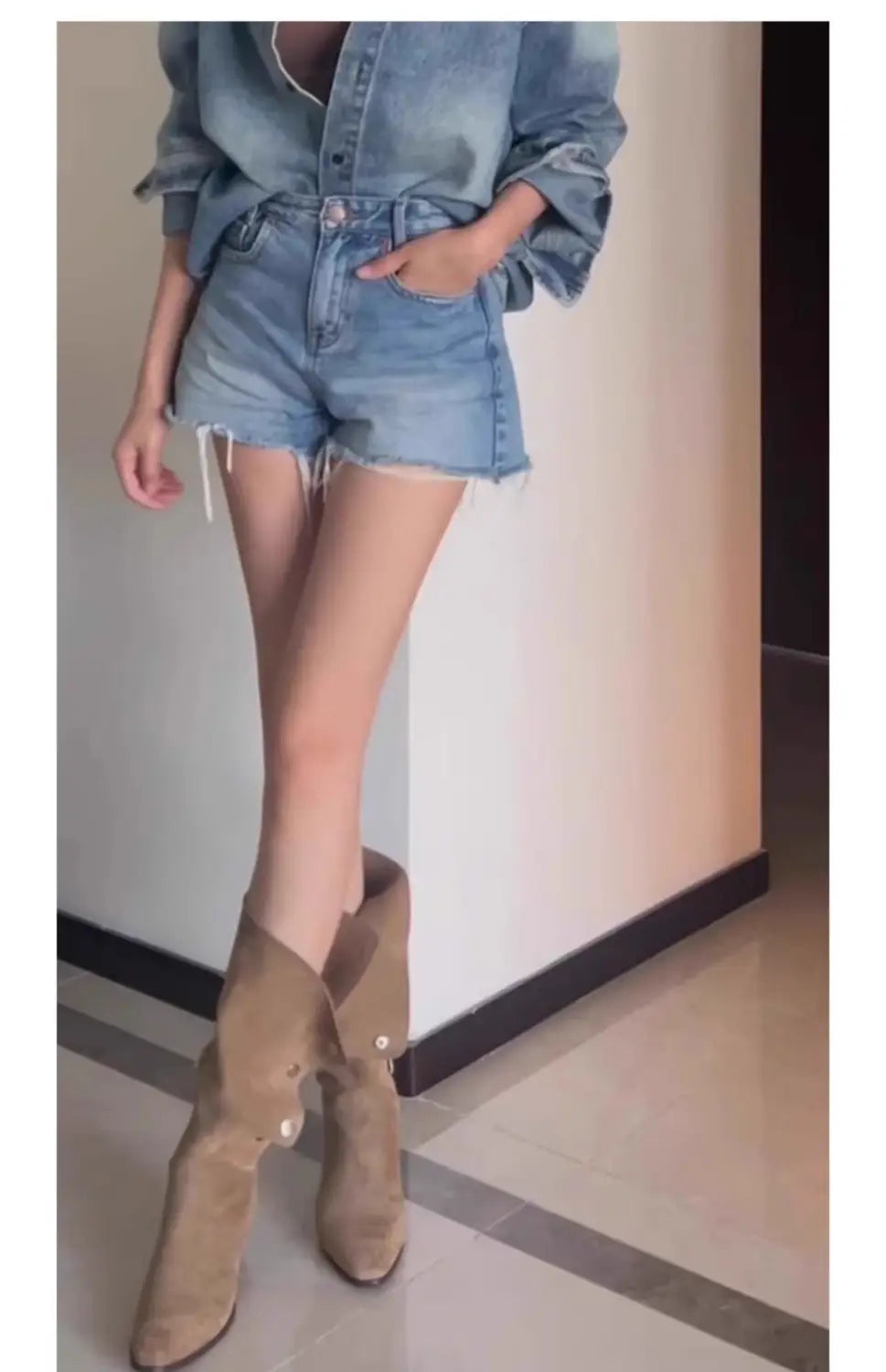 tan suede western cowboy pile style boots with slight heel and decorative buttons on the outer side in flip pile style