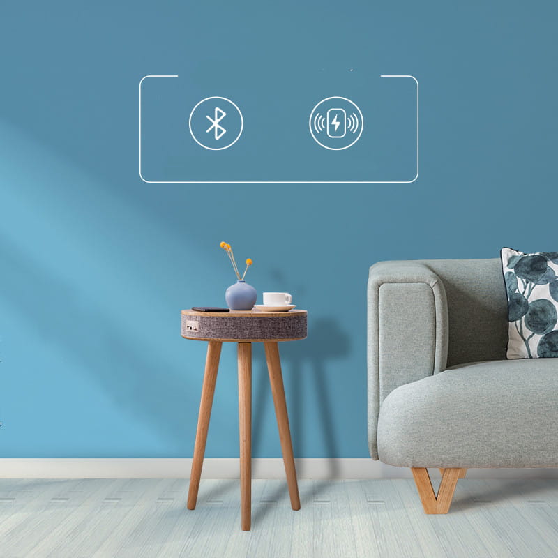 wooden tripod side table with textured gray top in log color featuring a smart voice integrated bluetooth wireless charging pad