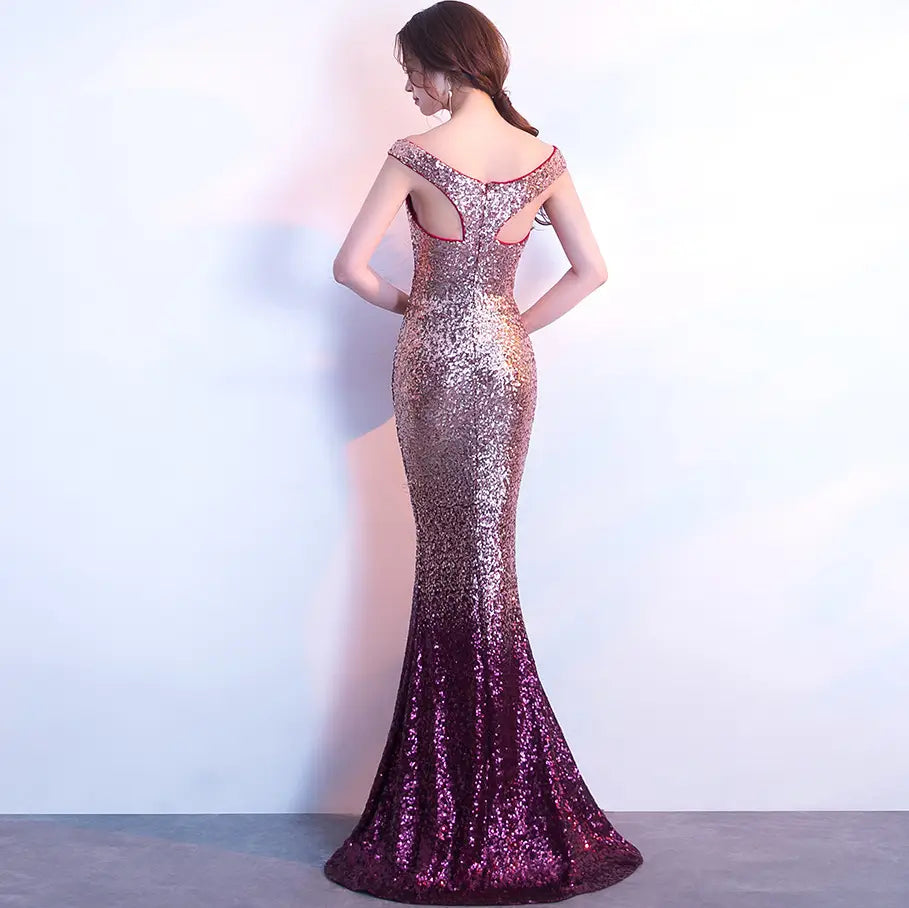 rose gold sequined long slim fit mermaid gown with a shimmering gradient from rose gold to deep purple featuring an off-the-shoulder back with cutout details designed as a slim fit fashion host gown