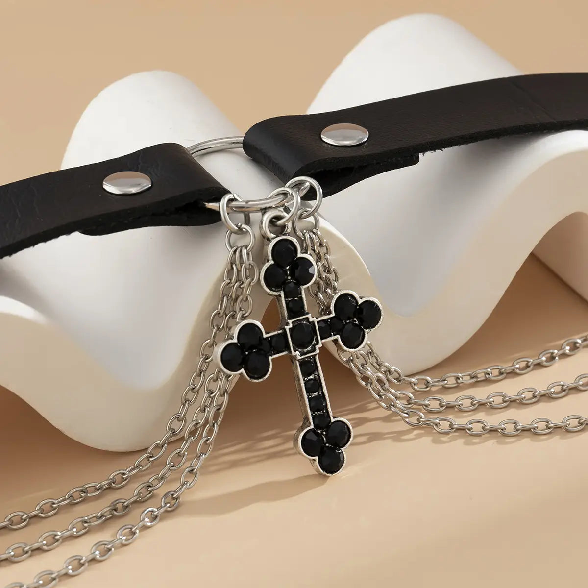 black leather choker alloy necklace cross with a silver alloy necklace pendant featuring black rhinestones and dangling silver chains made from jewelry pu alloy.