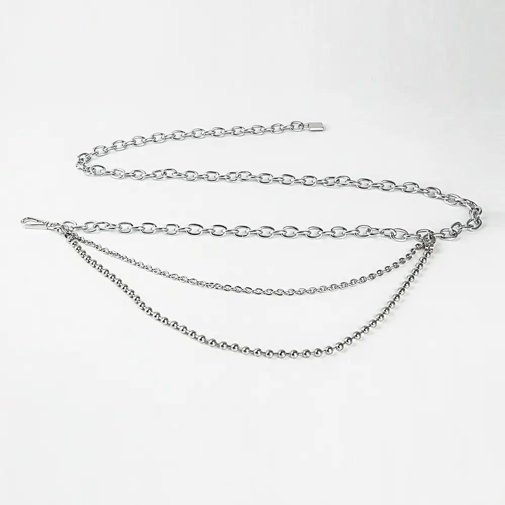 silver chain belt featuring a combination of oval links and ball chains with a sleek metallic finish designed as summer body jewelry and body jewelry hip accessory.