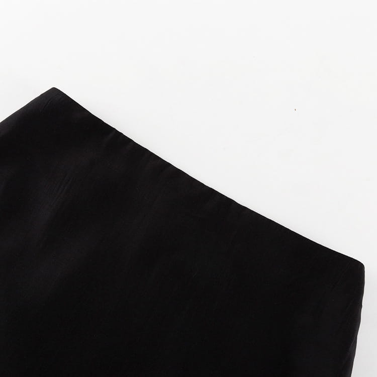 black velvet fabric with a smooth, slightly textured surface used for a black sheer high waist slit sheath skirt.