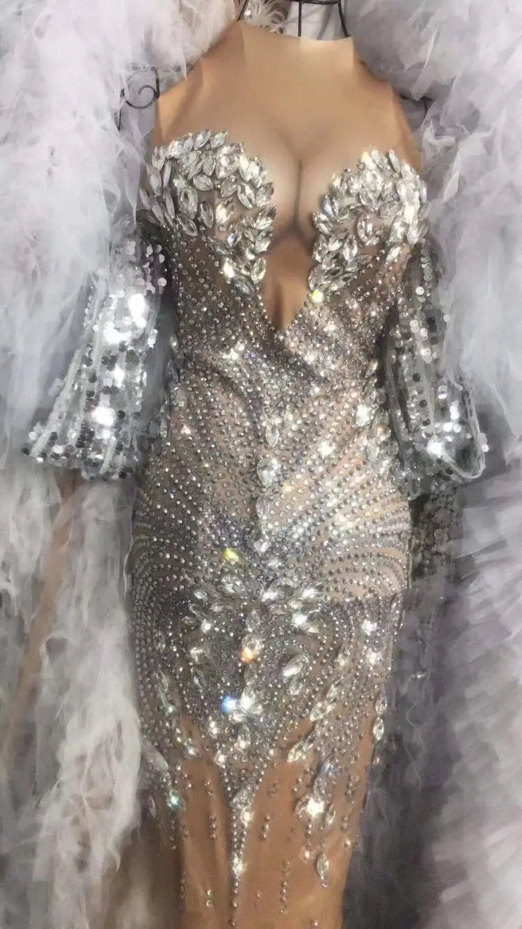 A dazzling silver sequined evening gown with a plunging neckline, bell sleeves, and sparkling rhinestones designed for nightclub dj female and female singer european stage nightclub performances.