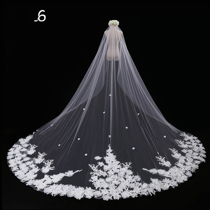 long lace wedding veil meters wide style in white lace with floral appliqués and scattered beading along the hem.
