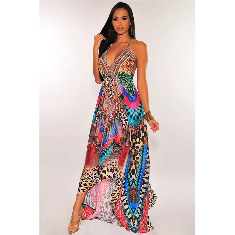 A vibrant floor-length retro pattern sexy halter dress featuring a bold leopard print mixed with colorful feather-like patterns in pink blue green and orange.