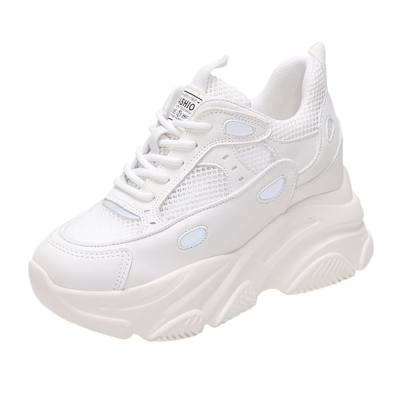 White chunky platform casual sports single sneaker with mesh and synthetic leather panels featuring oval cutouts and a thick rubber sole for comfortable wear.