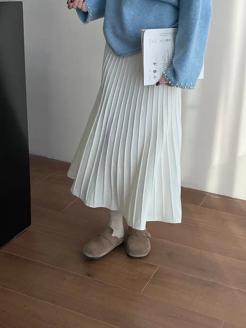 a flowing off-white korean elastic waist knitted pleated midi skirt made of soft textured fabric