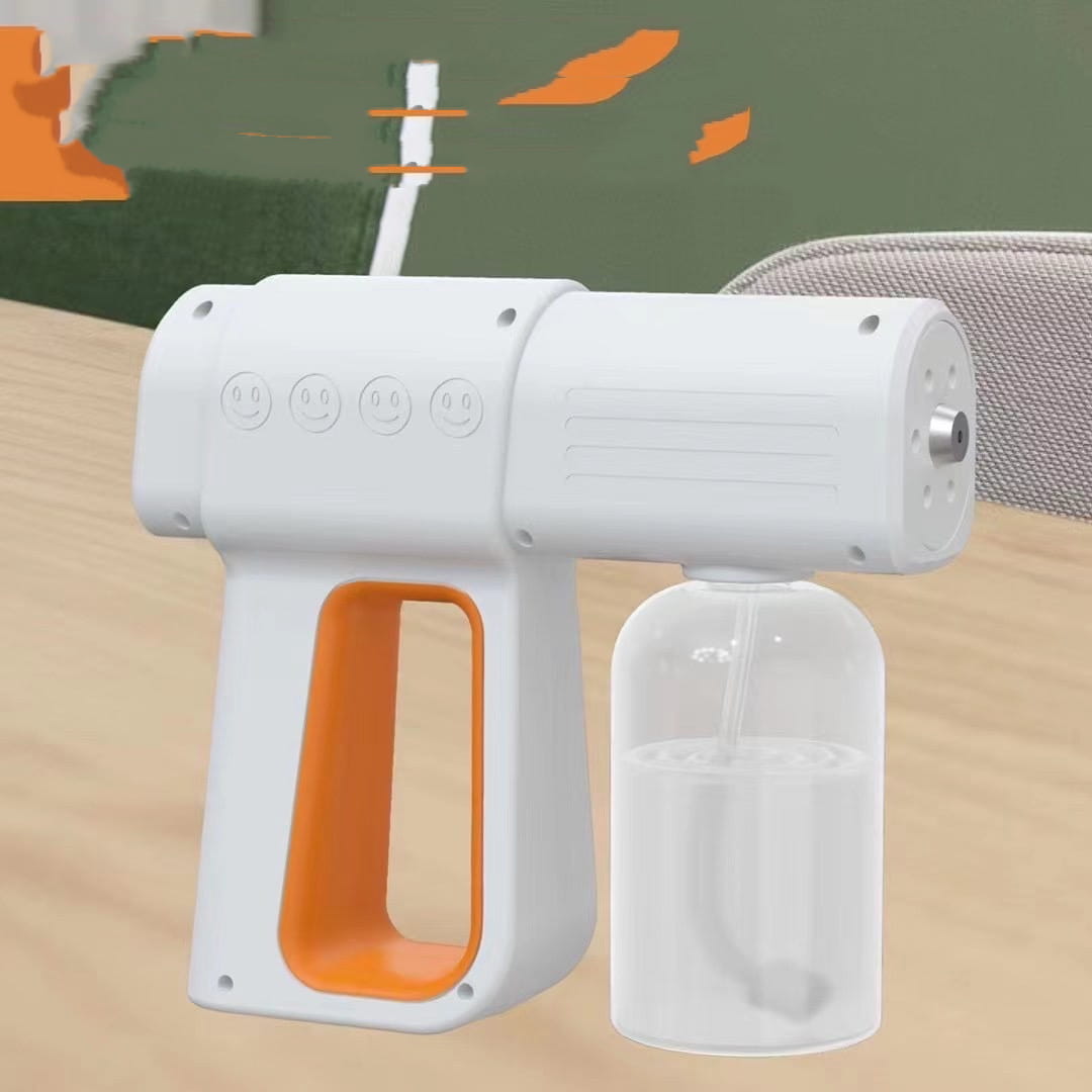 White and orange k5 pro electric sanitizer sprayer disinfection gun with a clear liquid reservoir and smiley face buttons on the grip for easy handheld use.