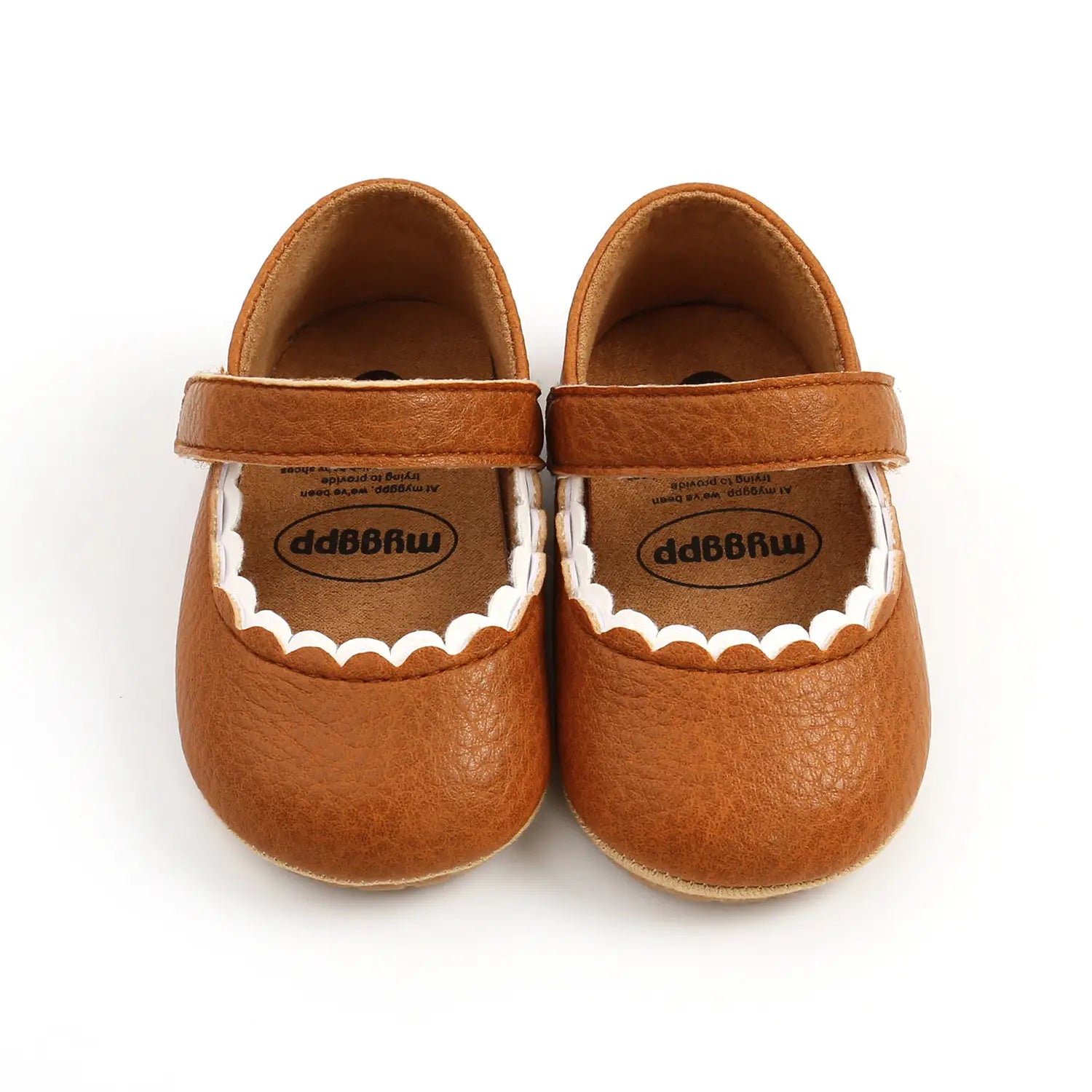 tan leather baby princess shoes with white scalloped trim in mso-font-pitch variable style