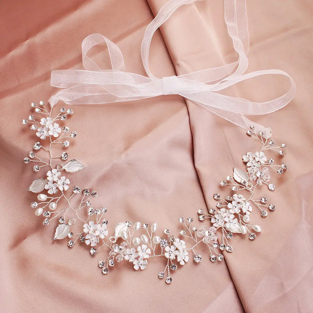 A delicate silver pearl handmade headband featuring alloy flower details, clear crystals, pearl-like beads, and lace ribbon ties.