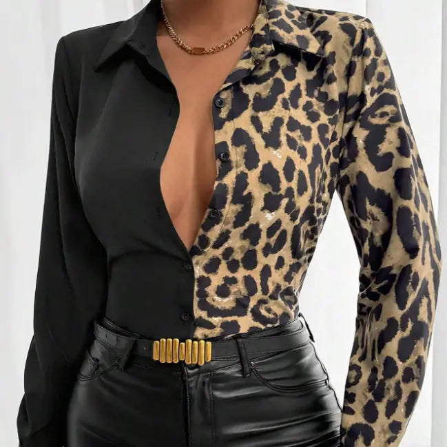 a leopard print belted shirt featuring a split design with black and tan leopard print on one side and solid black fabric on the other