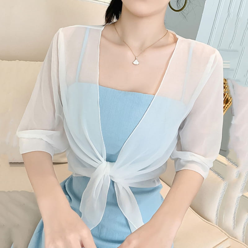 Light blue sheer chiffon short shawl summer coat with three-quarter sleeves and a tied front knot designed as a summer coat sun accessory.