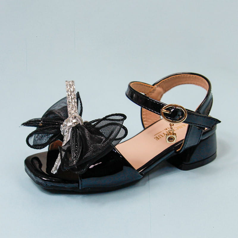 black patent leather girl soft-soled net beach shoes featuring a sheer black organza bow with silver rhinestones and a gold-tone ankle strap buckle