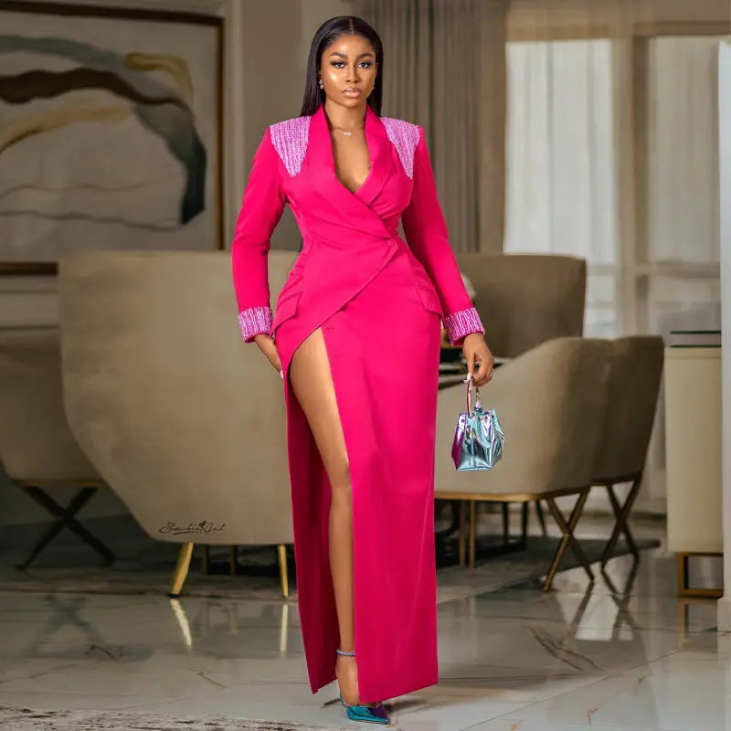 A vibrant fuchsia rose red suit collar embellished wrap dress with sparkling pink embellishments on the shoulders and cuffs.