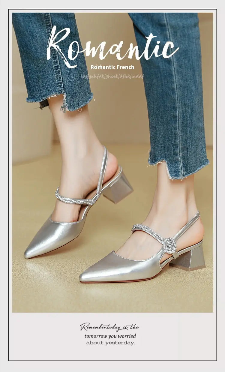 Silver metallic pointed toe high heels with chunky heel slingback design and crystal embellishments on the strap
