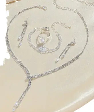 Silver rhinestone necklace with a delicate chain and sparkling embellishments from the fashion simple necklace earring bracelet set.