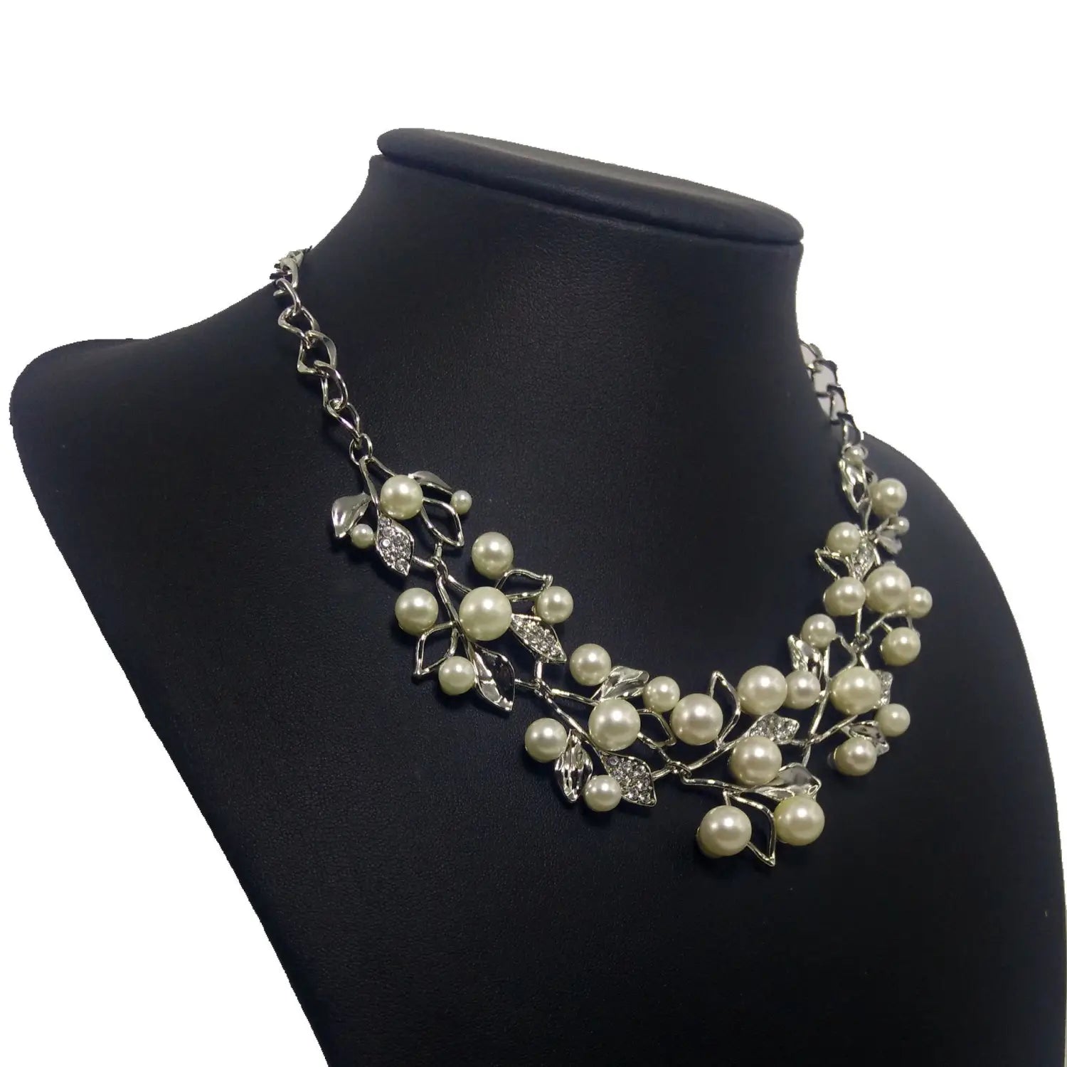 silver-toned clover necklace jewelry featuring an intricate vine design with cream-colored pearls and sparkling rhinestones as elegant necklace jewelry accessories and earrings.