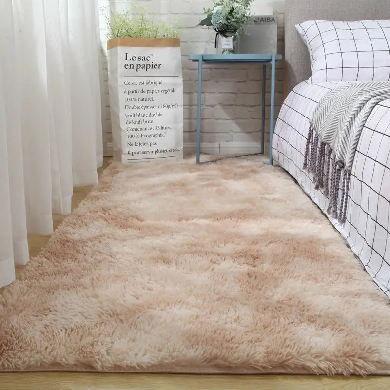a plush gray carpet floor mat with a soft beige faux fur texture and slightly uneven shaggy pile providing a comfortable plush carpet floor experience