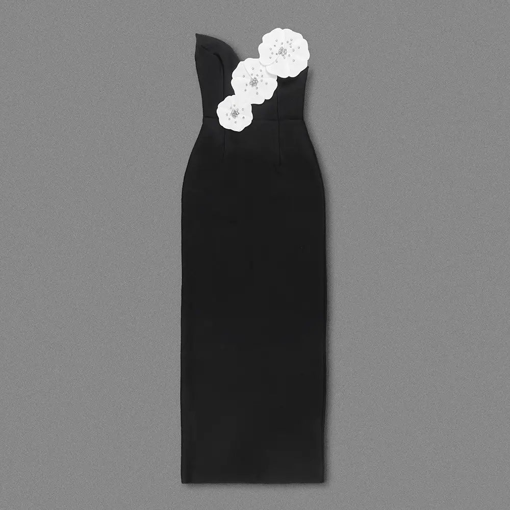 black backless bandage gown featuring a strapless design with three white floral appliqués with sparkling centers on the bandage chest white material