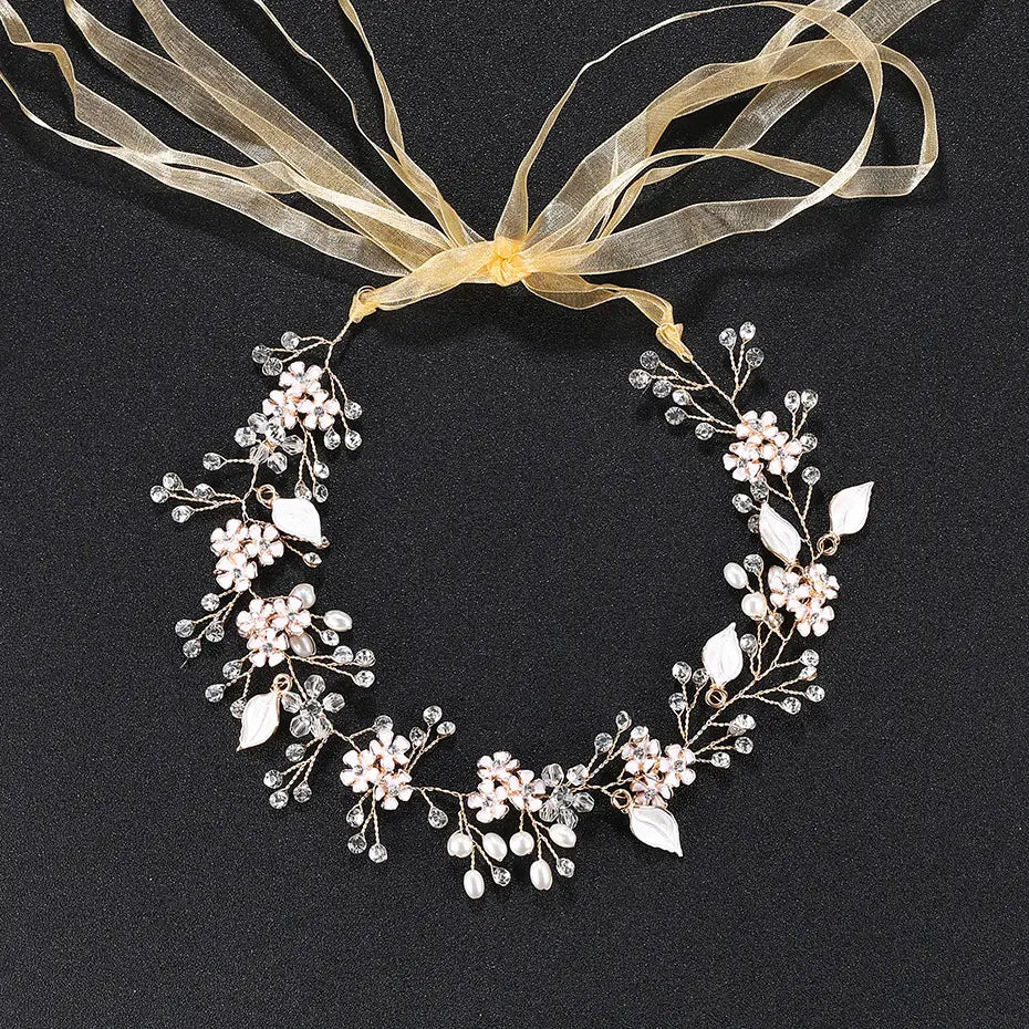 Delicate pearl handmade headband featuring alloy flower crystal headpiece with pink and clear crystals, pearl-like beads, silver-toned wirework, and soft gold ribbon accent.