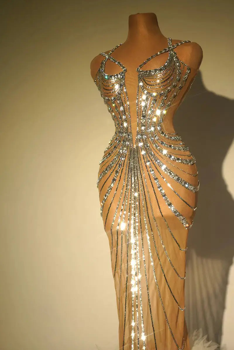 a shimmering rhinestone feather dress banquet gown featuring a form-fitting silhouette with intricate silver beading and sequins cascading in radiant lines down the front
