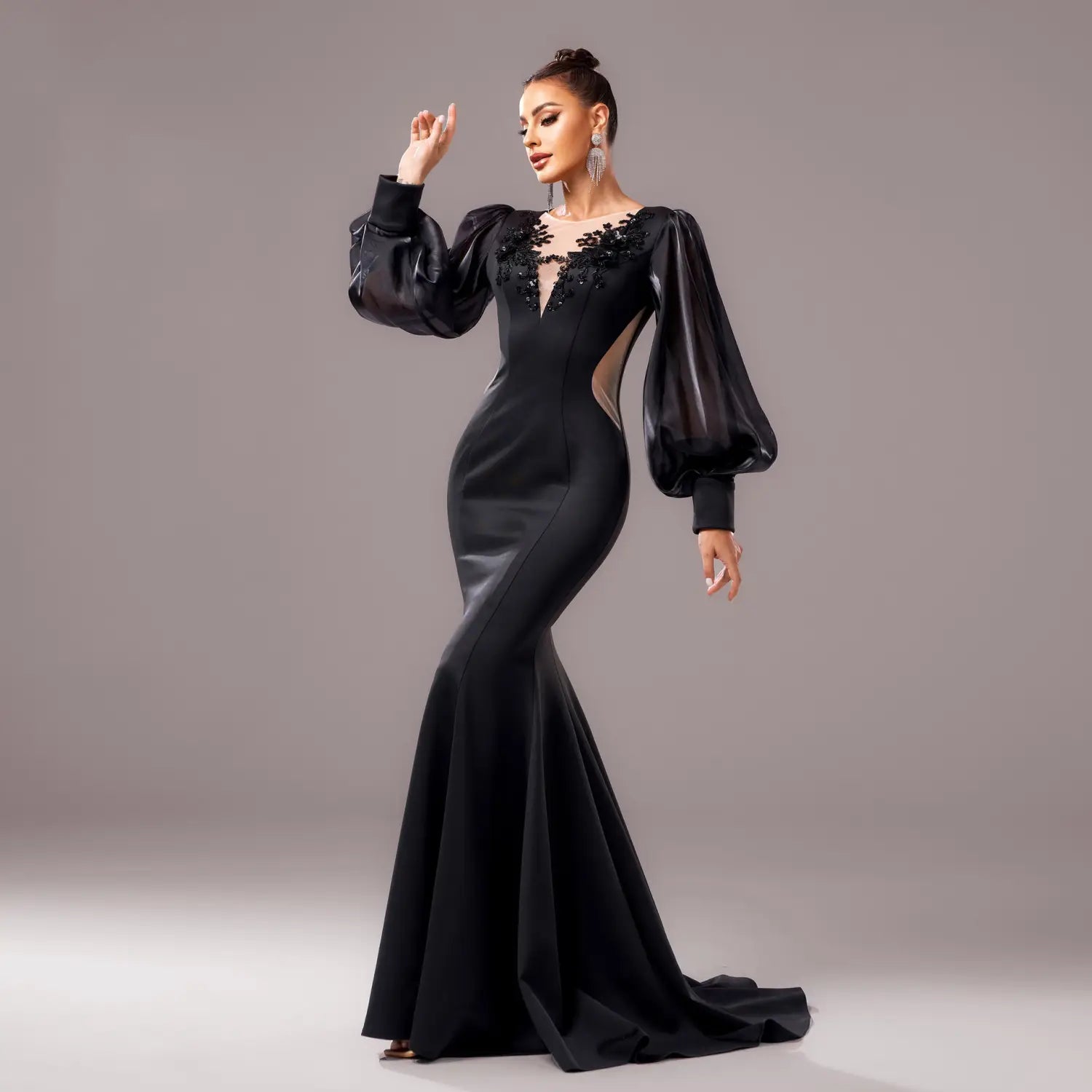 Elegant black beaded long sleeve round neck fishtail gown featuring sheer puff sleeves and intricate lace detailing at the neckline.