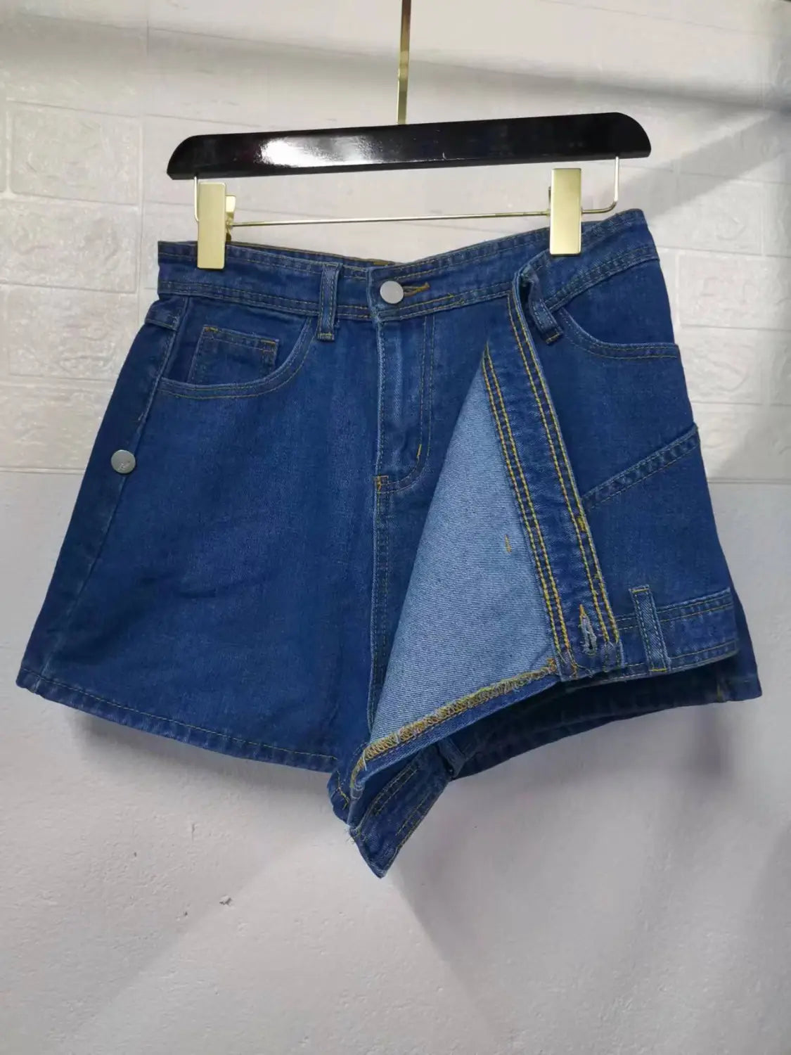 blue denim y2k street vintage asymmetrical skorts skirt featuring a split front design with contrasting yellow stitching and street vintage denim material