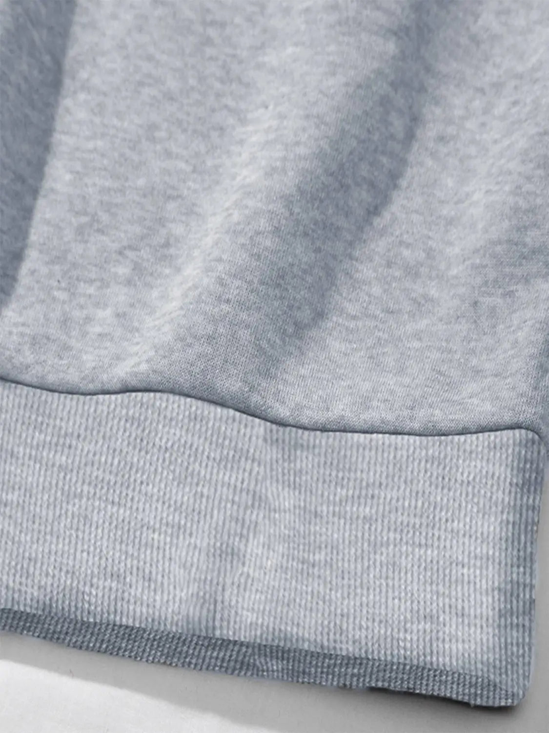 gray heathered sweatshirt cuff with ribbed knit trim on a white glitter lips pocketed long sleeve sweatshirt