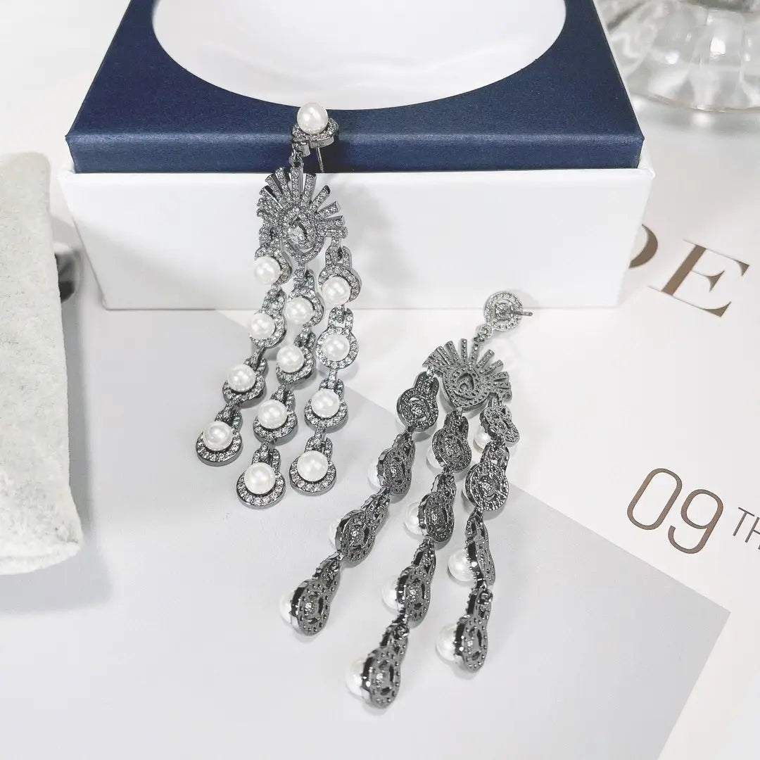 Elegant silver pearl micro inlay zircon style beaded fringe earrings featuring cascading strands of pearls and intricate filigree detailing.