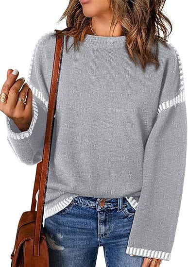 Gray knit solid round neck pullover sweater with white striped accents on the sleeves and hem.