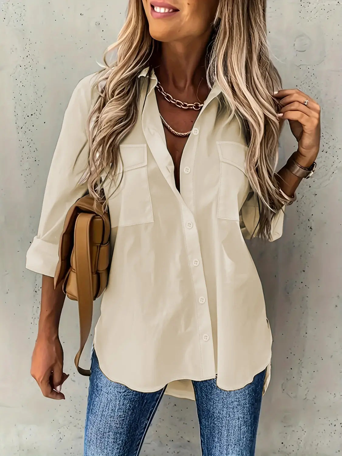 beige long sleeve lapel button down shirt with two chest pockets and rolled up sleeves in a loose long sleeve fit
