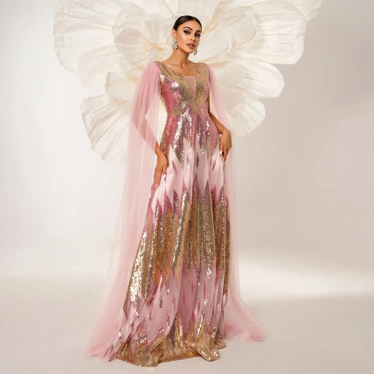 a shimmering pink and gold sequins large swing dress with long sleeve mesh and a flowing sheer overlay