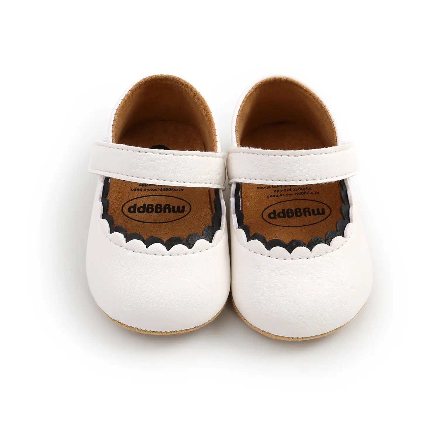white leather baby princess shoes with scalloped black trim and velcro strap featuring mso-font-pitch variable design elements