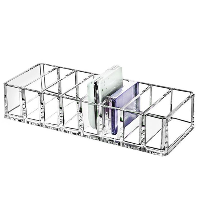 clear acrylic rectangular makeup organizer with multiple compartments holding a white and purple phone case in a makeup organizer image