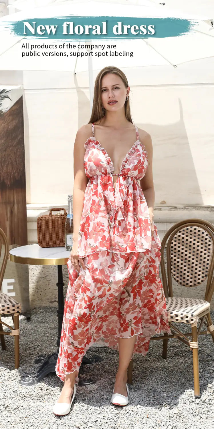 A flowing, two-piece fashion simple dress in soft pink and white floral print with a tiered skirt and delicate spaghetti straps.