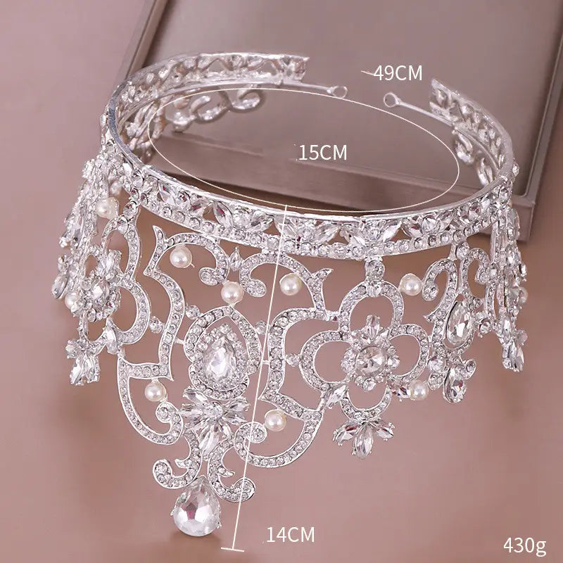 silver ornate tiara adorned with sparkling crystals and dangling pearls from the crystal crown catwalk collection