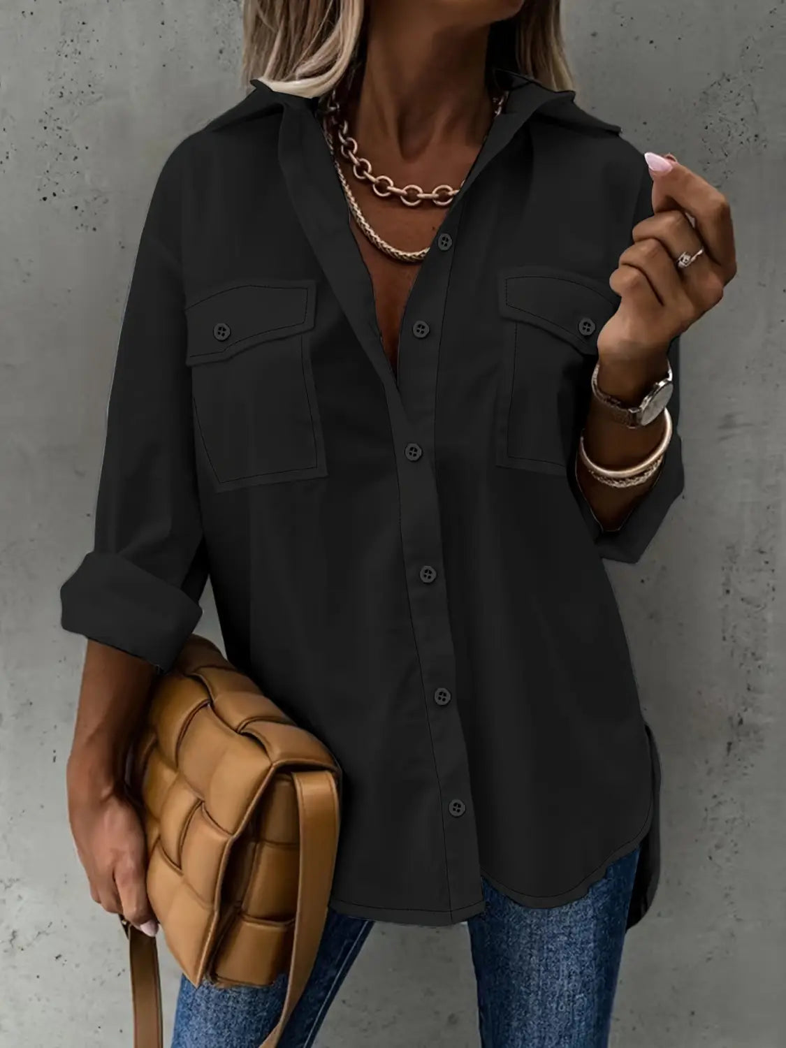 black long sleeve button-up shirt with two chest pockets and rolled sleeves in a loose long sleeve lapel design